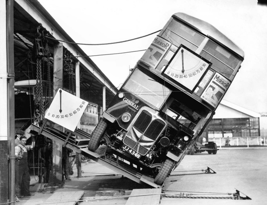 Image of  double decker English bus tipped over at 33 degree angle. Image was made to show these buses would not tip over.